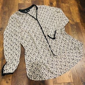 Fits like a Large. Leather trimmed blouse.